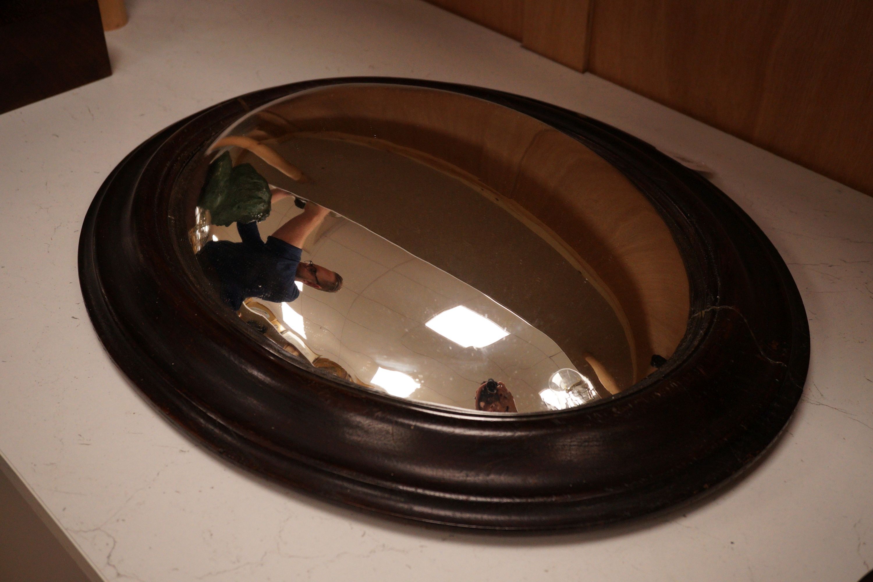 An unusual 19th century oval framed convex wall mirror, 44x54cm including frame